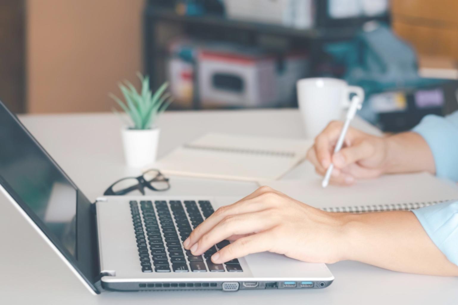 Financial market analysis workspace with data charts and business reports